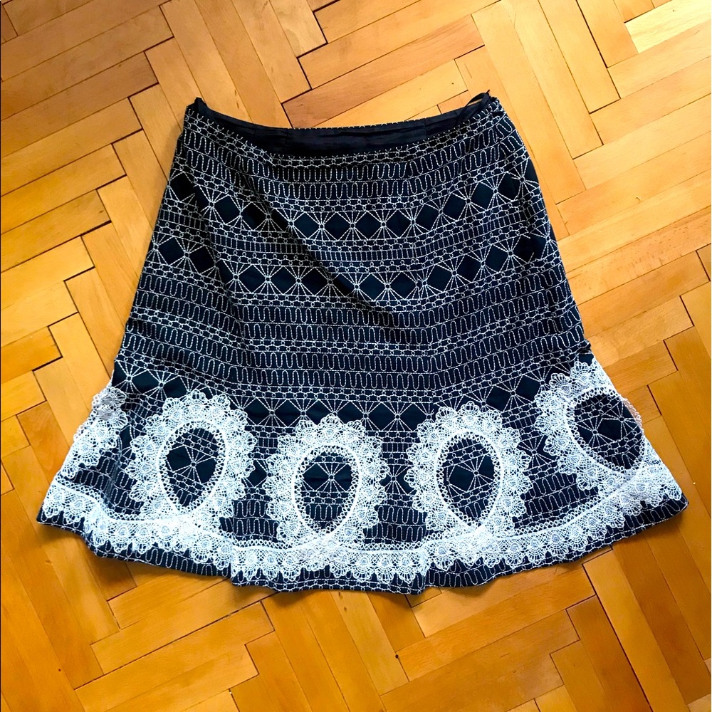 Black flared skirt stitched with white lace, size 10p